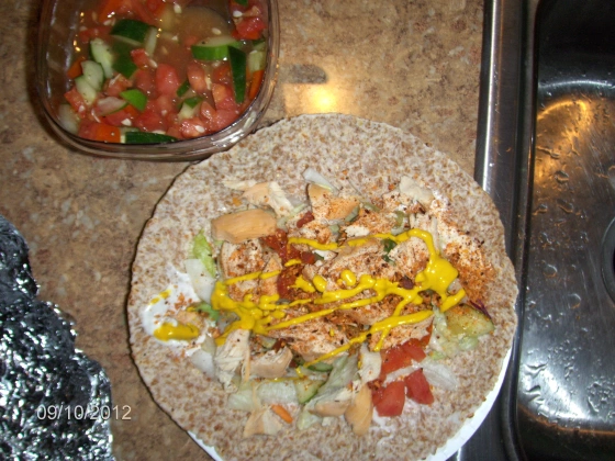 Ezekiel 4:9 Wrap with boiled chicken, tomato, cucumber, light mayo, mustard, chipotle seasoning, and avocado